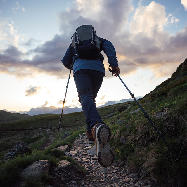 Person hiking up a mountain