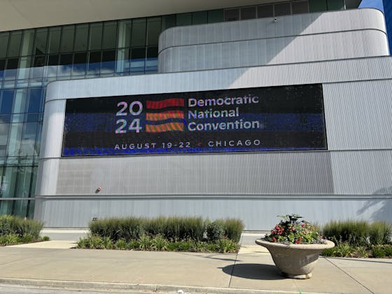 A monitor outside Wintrust Arena in Chicago's McCormick Place displayed the logo of the 2024 Democratic National Convention on the opening day of the event.