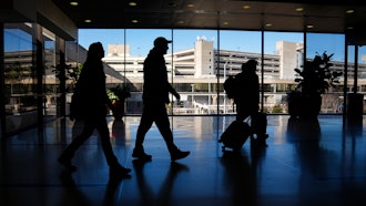 Travelers walk through Philadelphia International Airport, Feb. 16, 2024.