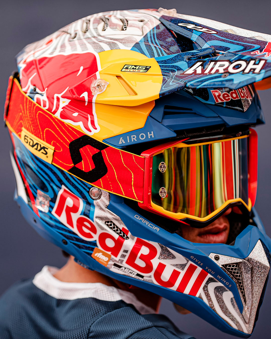 A man wearing a motocross helmet with the SCOTT limited edition goggle