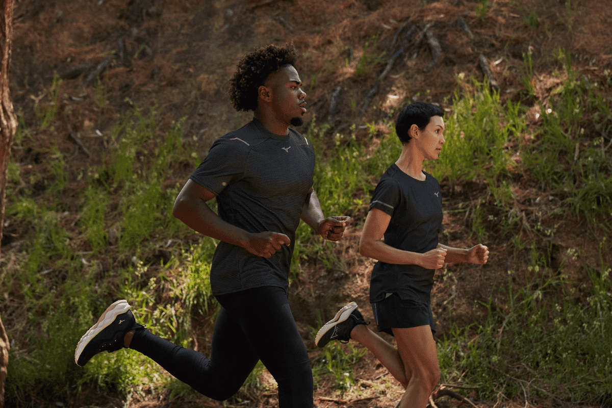 Man and women running in Mizuno Eco-Friendly gear.