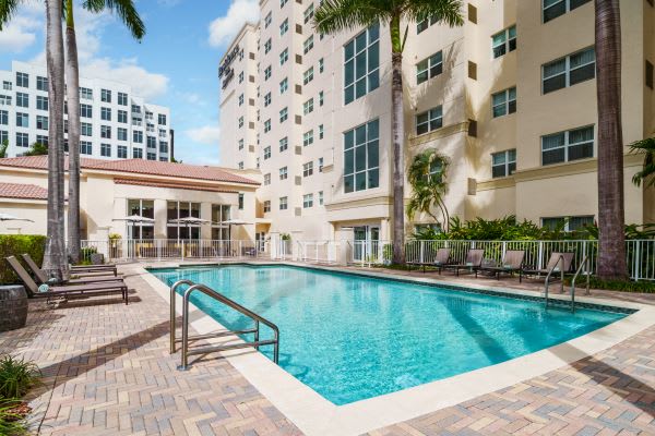 Outdoor pool and exterior of the Residence Inn Miami Aventura Mall