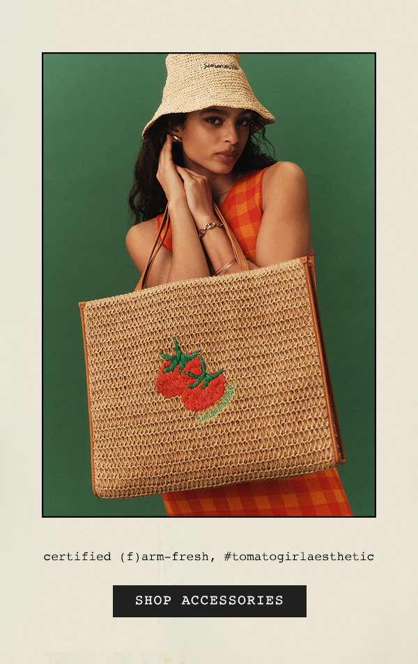 Woman holding tote. Shop accessories.