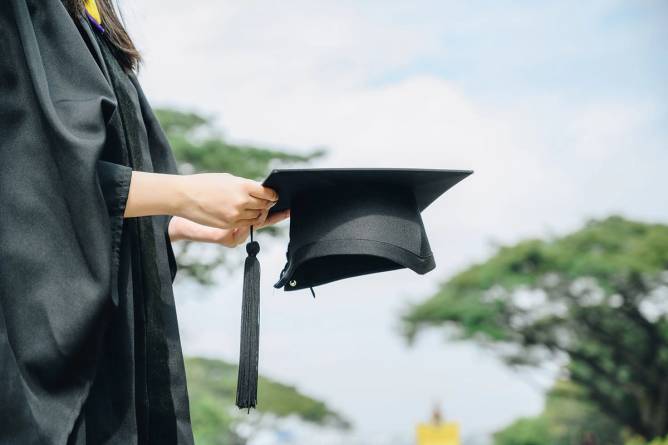 College graduate in a cap and gown