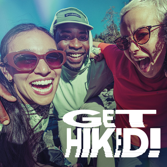 Hikers smiling in the sun. Get Hiked.