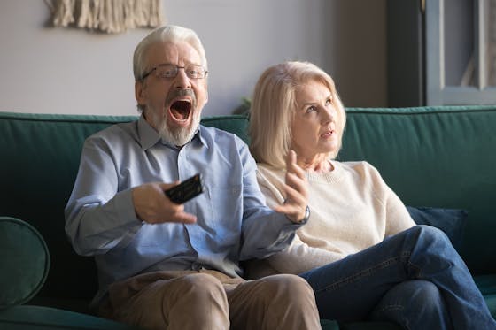 Senior mature couple with differing emotions anxiety anger distress 