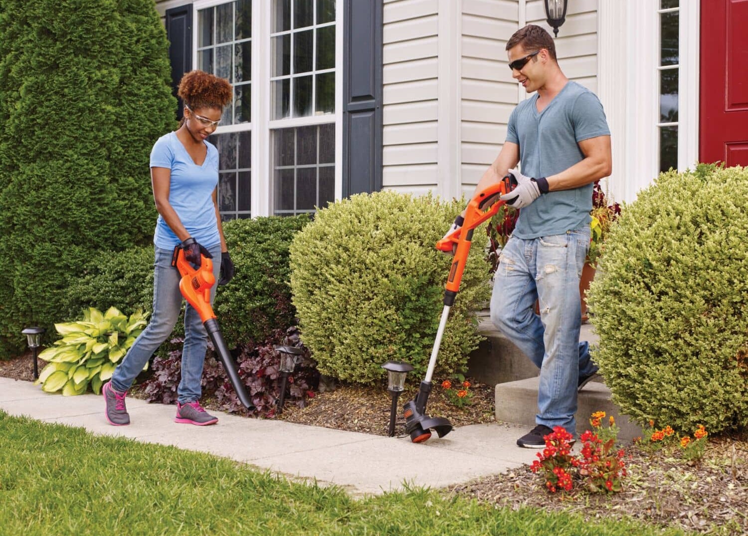 couple using black+decker outdoor tools