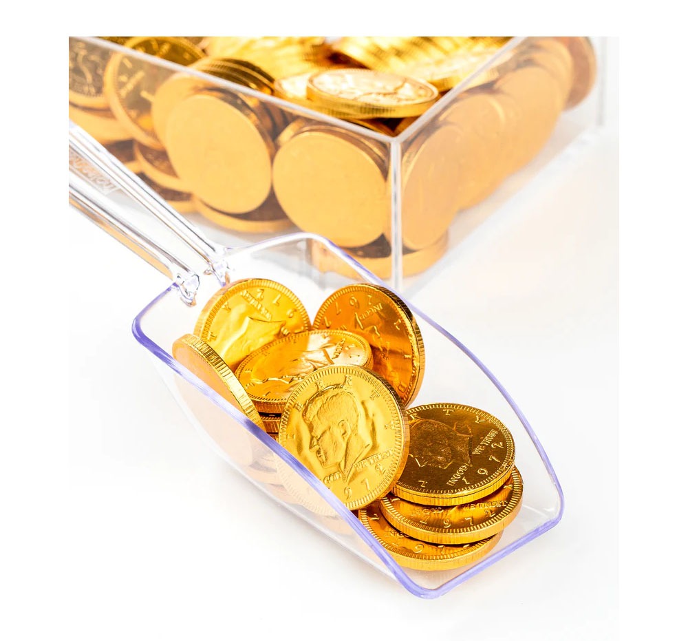 Gold foil coins in a scoop