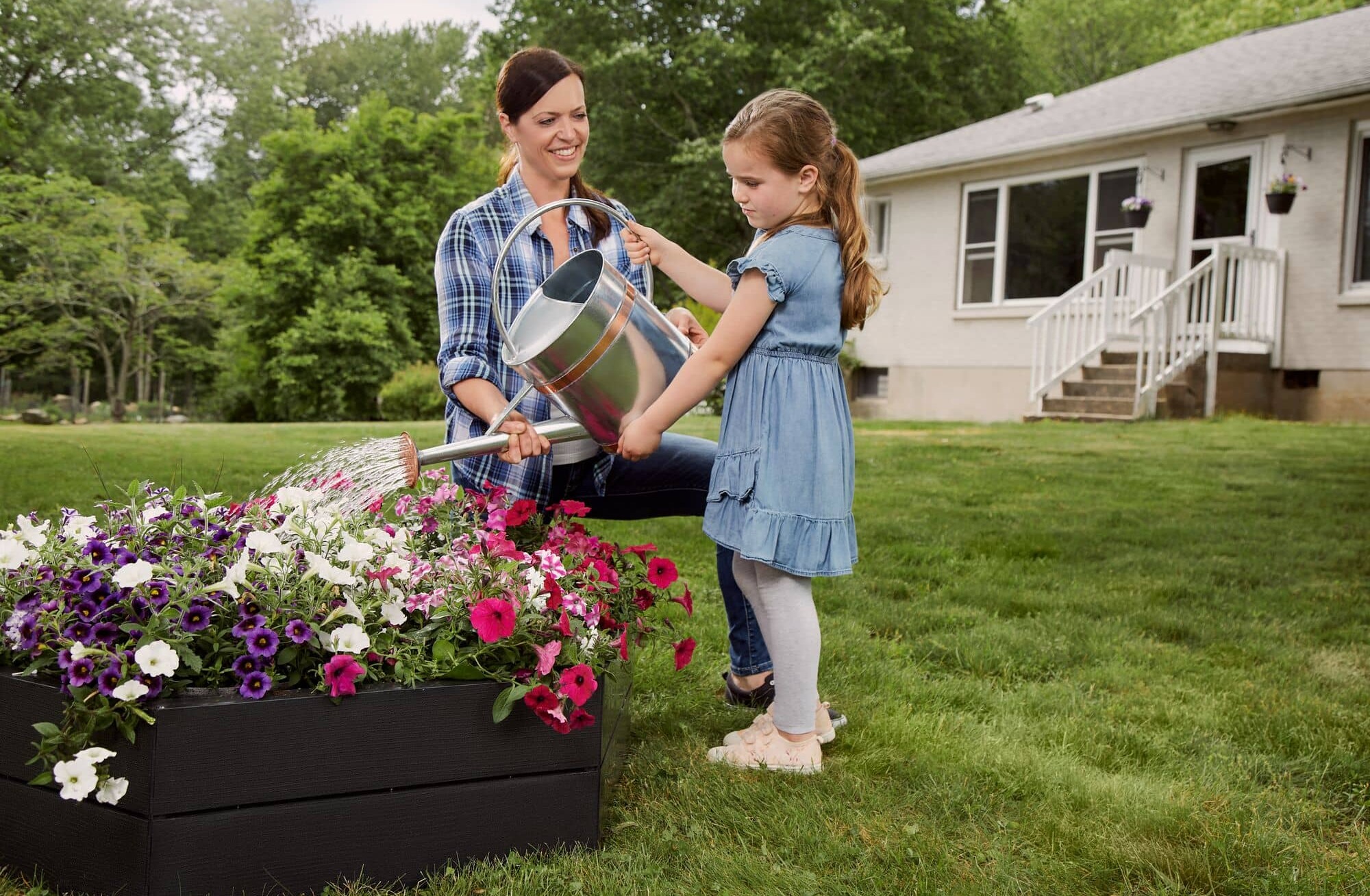 Woman and girl outside with flowers