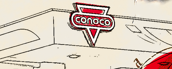 Sign above highway that has Conoco logo.