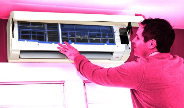 A man shows off his heat pump