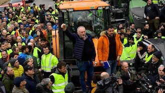 Farmers with their tractors attend a protest in Pamplona, northern Spain, Friday, Feb. 9, 2024. For fourth non stop days, farmers in Spain have staged tractor protests across the country, blocking highways and causing traffic jams to demand of changes in EU policies and funds and measures to combat production cost hikes.