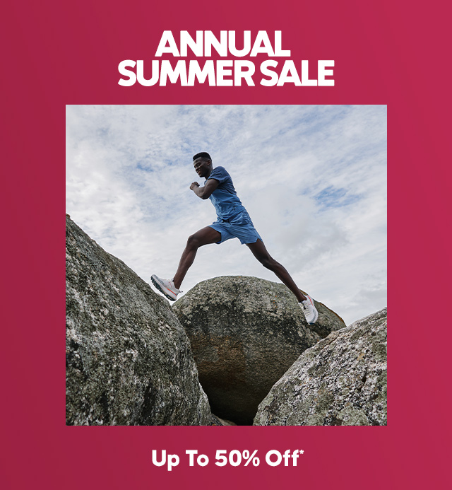 Annual Summer Sale with a man leaping over rocks.