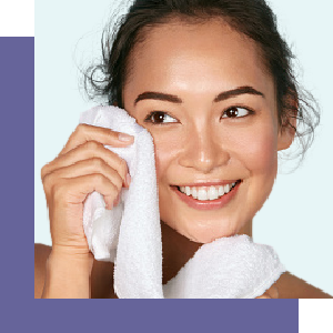 Woman drying her freshly cleansed face