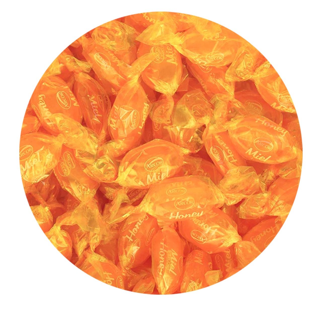 Close Up Bulk Photo of Golden Orange Wrapped Hard Candies