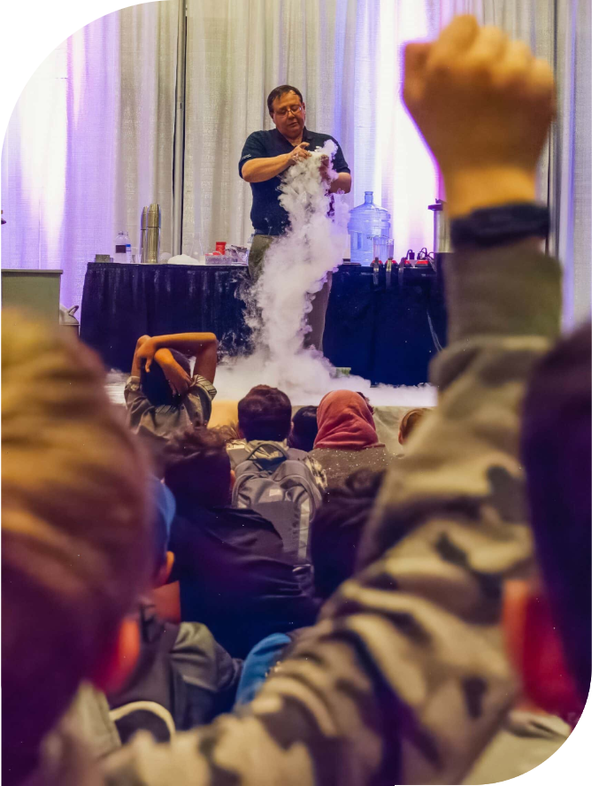 http://Presenter demonstrating science experiment at Canada Wide Science Fair