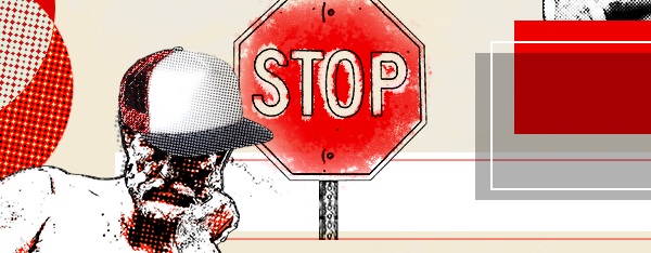 Background with statue that has a hat and a stop sign.