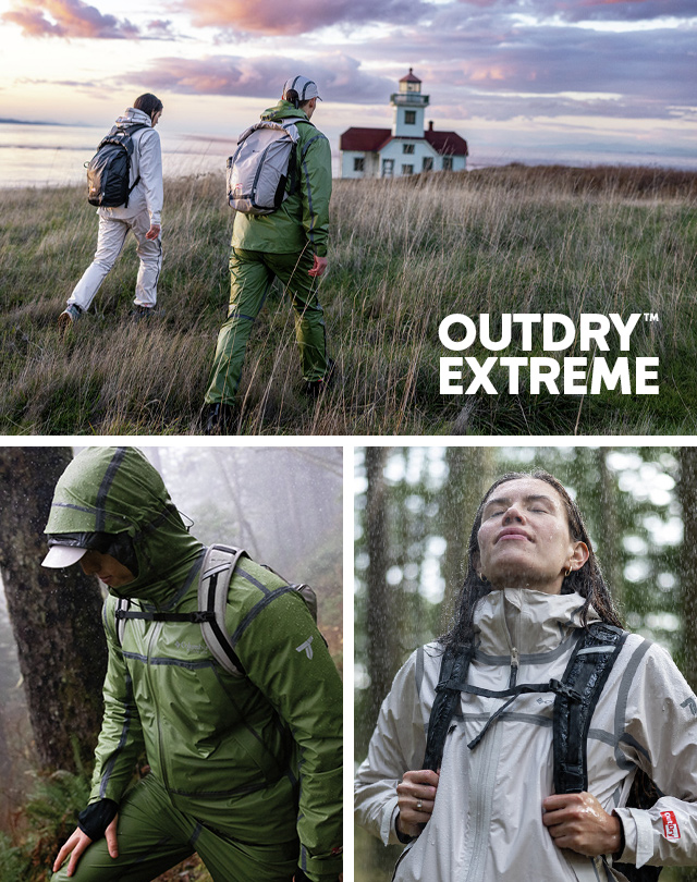 OutDry Extreme. A woman and man trekking in the rain with gear featuring Outdry Extreme. 