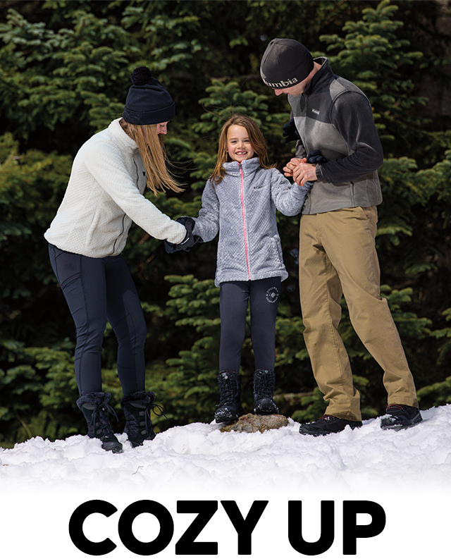 Cozy Up. A family in the snow wearing fleece