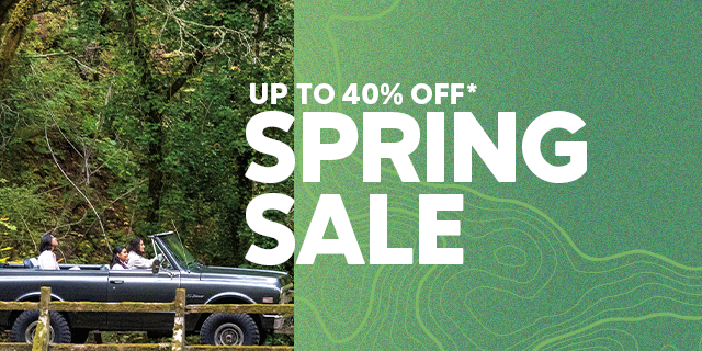 Friends driving through a lush landscape on their way to the trail. UP TO 40% OFF SPRING SALE.