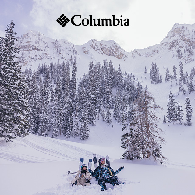 Skiers in Columbia gear make snow angels. 