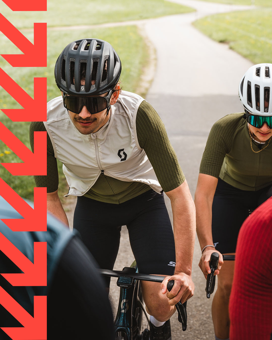 A group of cyclists riding with the new SCOTT ULTD. Collection