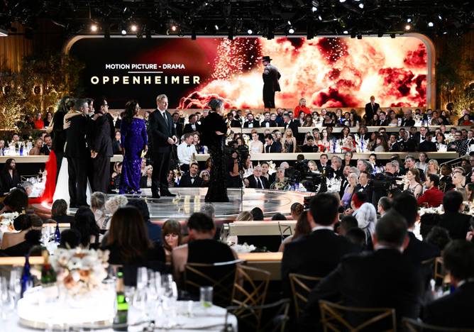 Oprah Winfrey, Emma Thomas, Christopher Nolan, Robert Downey Jr., Charles Roven, Matt Damon and Ludwig Göransson at the 81st Golden Globe Awards