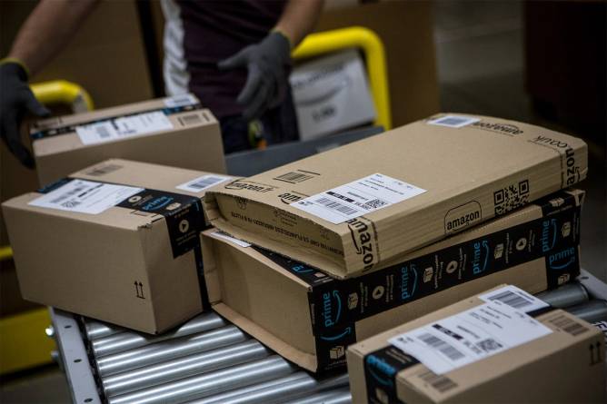 Amazon Prime boxes on conveyor belt.