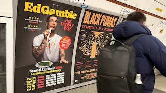 A poster advertising comedian Ed Gamble's Hot Diggity Dog tour on the Bakerloo line platform at Embankment station, London, March 27, 2024.