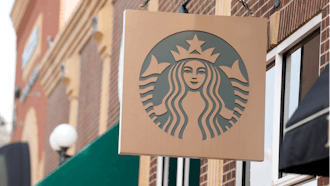 A Starbucks sign hangs outside a casino in Deadwood, S.D., Sept. 20, 2023.