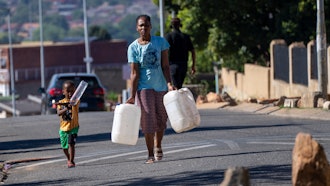 Residents line up for water, Soweto, South Africa, March 16, 2024.