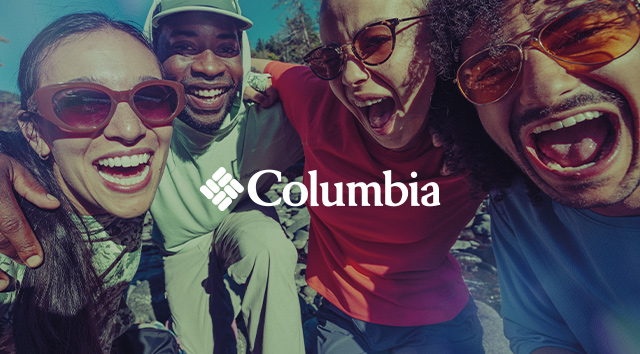 People hiking outdoors. Columbia logo. 