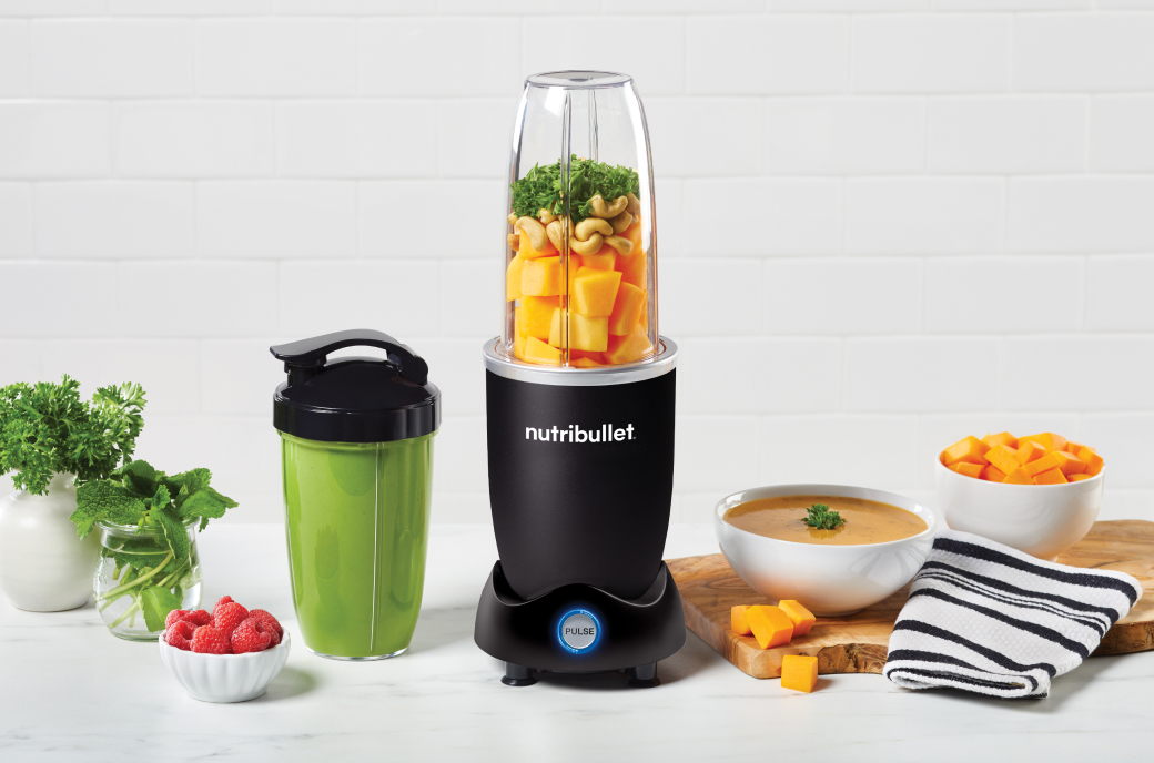 nutribullet Pro+ in the kitchen countertop next to a mix of meals