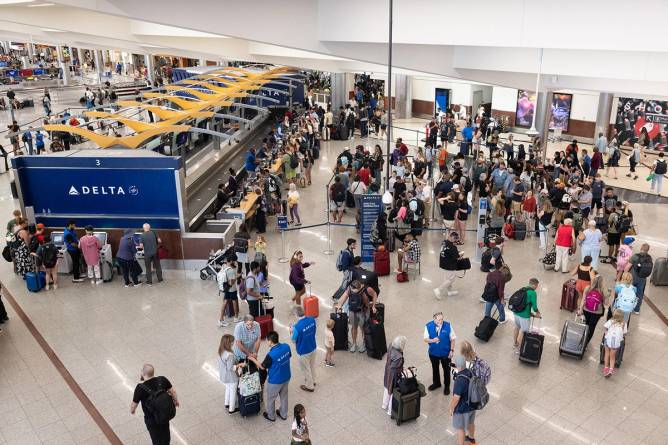 People waiting for help because their Delta flights were canceled