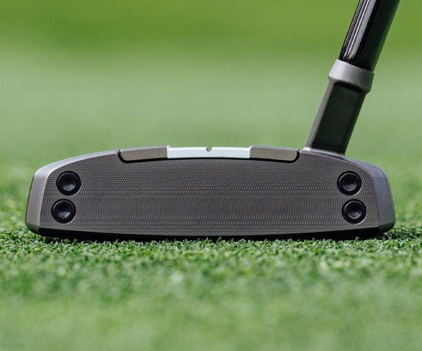 Spider Tour Proto putter showing milled face on green