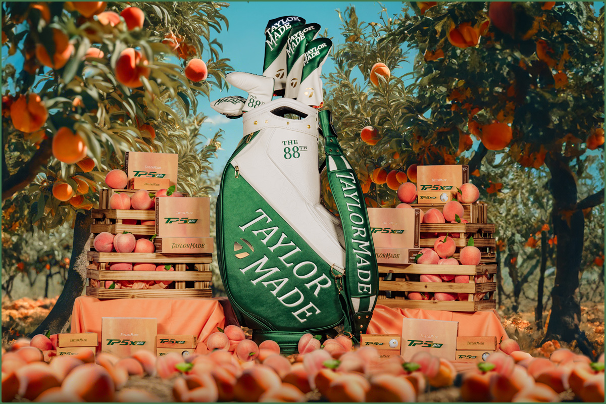 Season Opener Staff bag, full of clubs covered by the Season Opener headcovers, surrounded by fresh peaches and peach trees