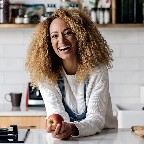 Woman Smiling in Kitchen