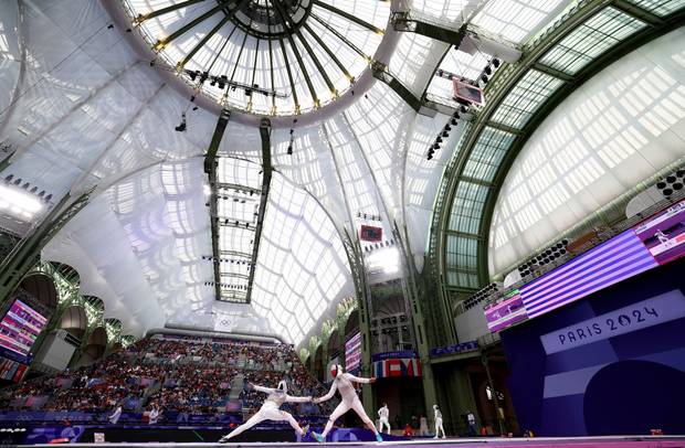 Lee Kiefer of Team United States (L) and Martyna Jelinska of Team Poland (R) compete in the Fencing Women's Foil Individual Table of 32 on day two of the Olympic Games Paris 2024 at Grand Palais