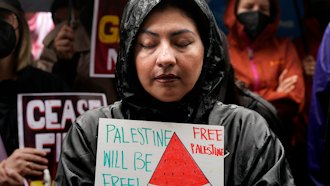 People participate in a sit-in demanding a cease-fire in the Israel-Hamas war, De Longpre Park, Los Angeles, Nov. 15, 2023.