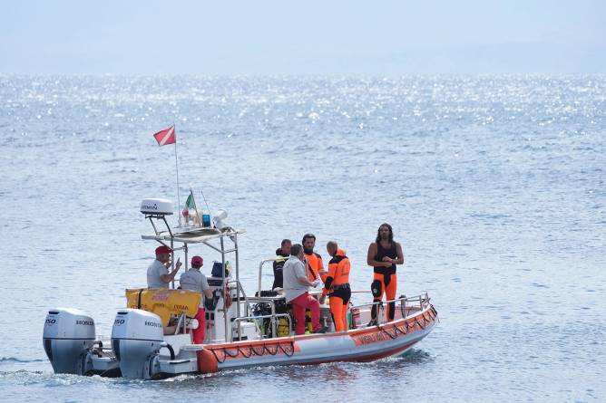 A search boat with crew explores the sea