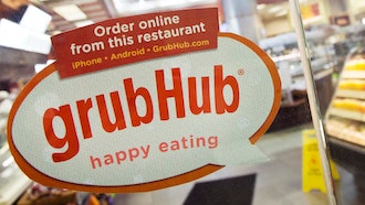 A sign with the old GrubHub logo displayed on the door to a New York restaurant, April 4, 2014.