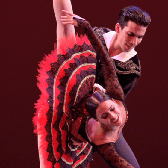 A close-up of a couple of ballet dancers in a dance pose