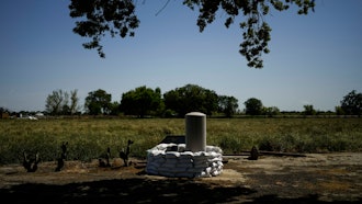 Sandbags stacked around a well in anticipation of flooding on the Kings River, Lemoore, Calif., April 19, 2023.