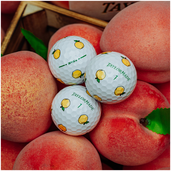 TP5x pix peach golf balls on a bed of peaches