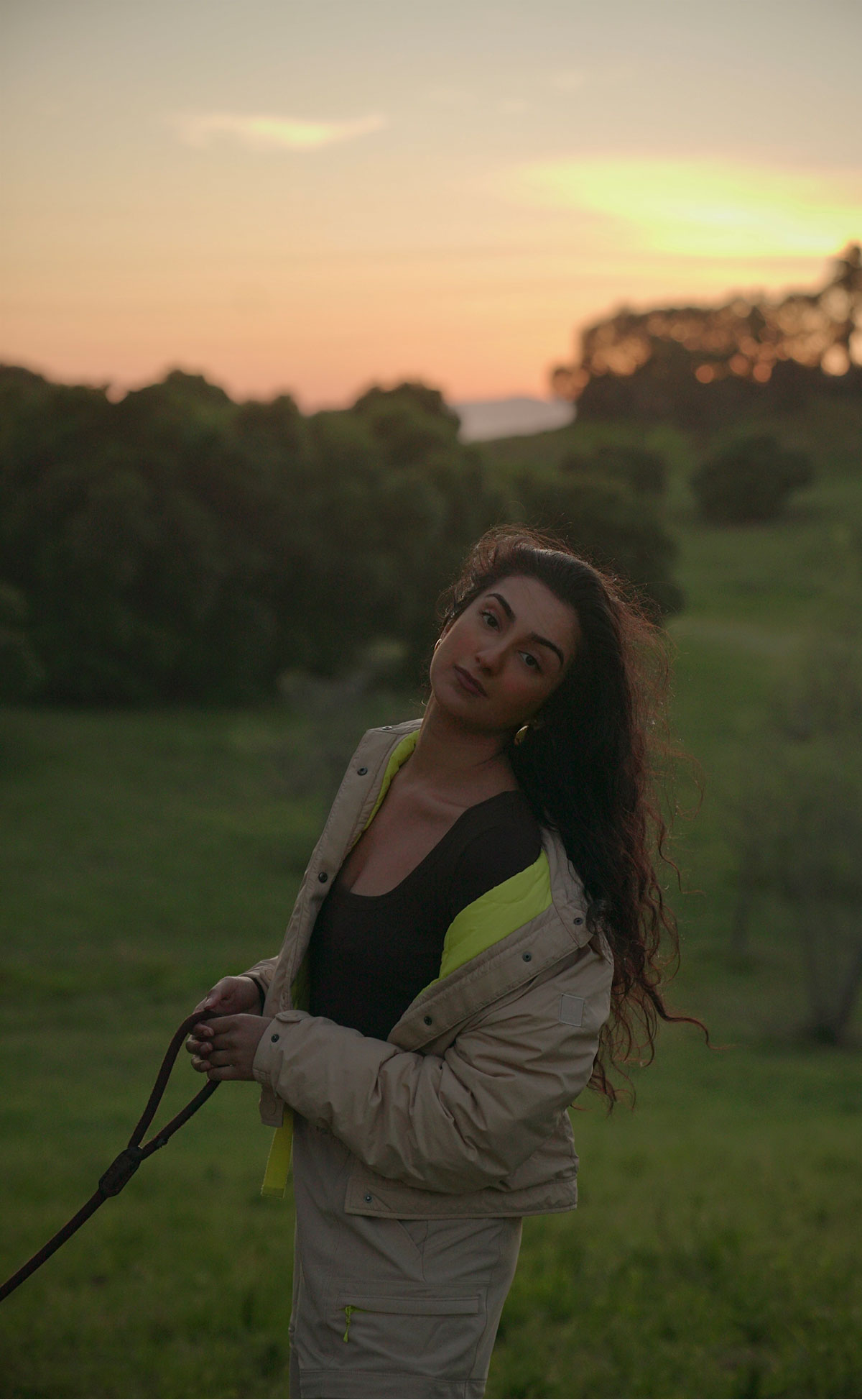 Aditi Mayer walking her dog at dusk