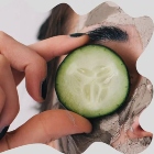 Person holding cucumber image