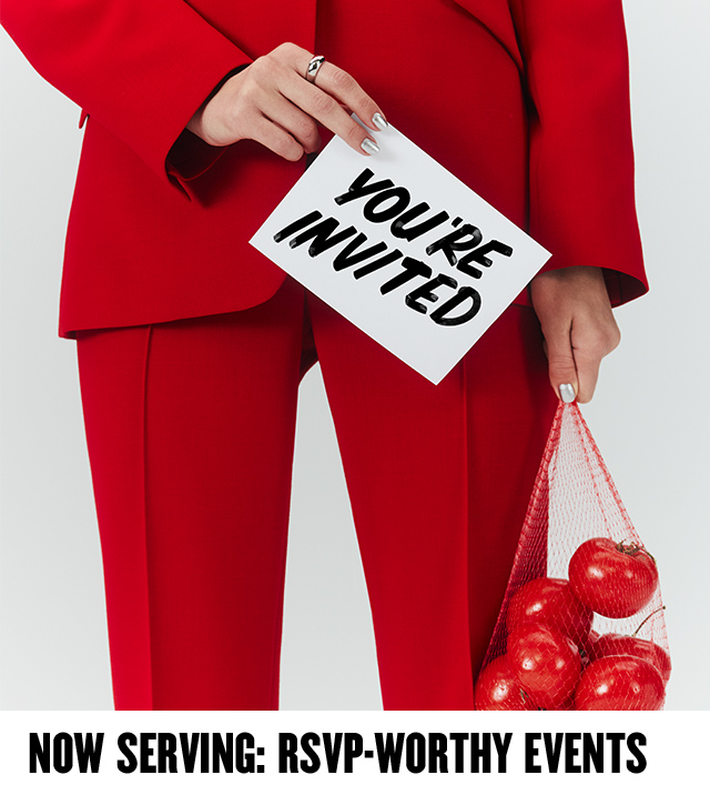 Now serving: RSVP-worthy Anniversary Sale events. Woman in red suit holding a sack of red tomatoes.