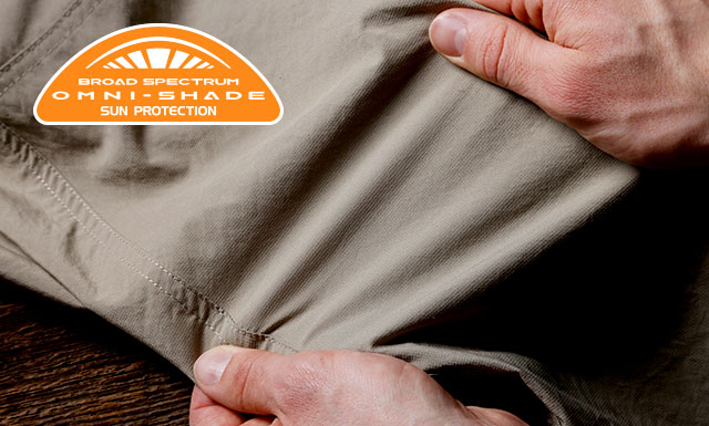 Close up of Silver Ridge Utility fabric with someone stretching it.