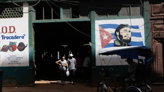 Shoppers exit a state-run agro-market, Havana, March 7, 2024.