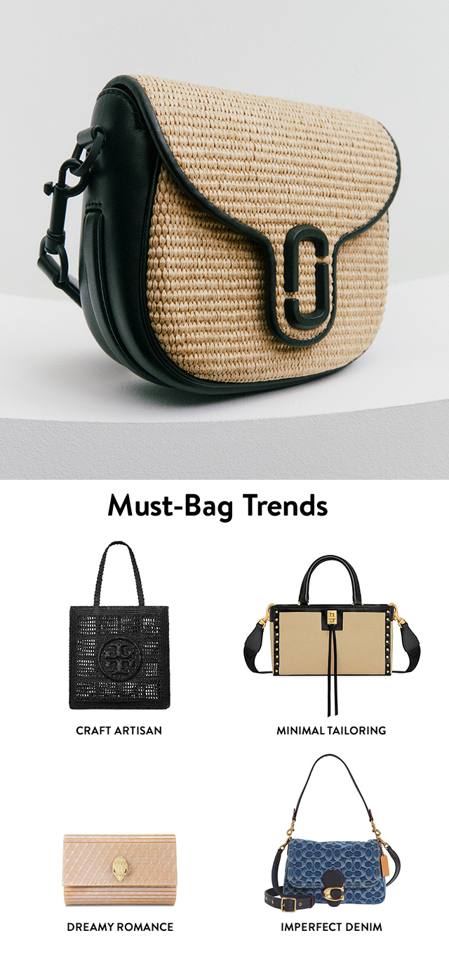 A raffia crossbody bag with black accents. A woven black tote with logo emblem. A beige top-handle bag with black trim and gold accents. A pale-pink clutch with goldtone eagle-head emblem. A denim shoulder bag with a logo-monogramed pattern and goldtone hardware.